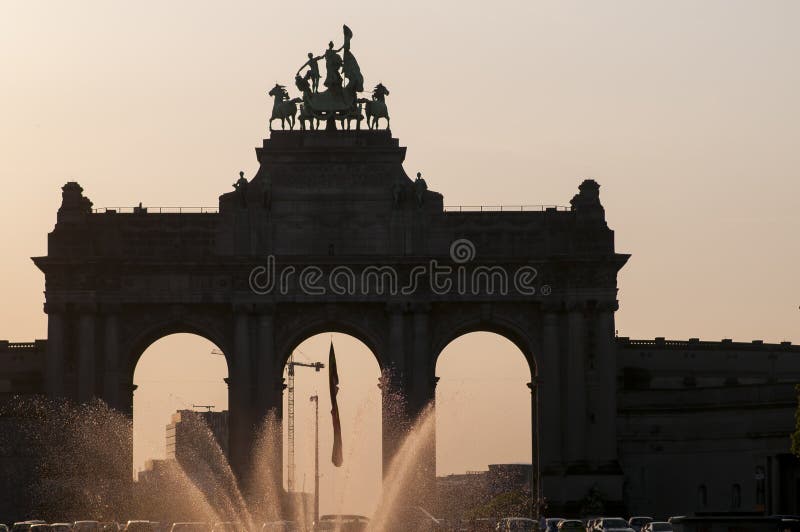 Brussels, Belgium, Triumphal Arch,Jubilee Park, Parc du Cinquantenaire with fountain in front at sunset. royalty free stock photography Brussels, Belgium, Triumphal Arch,Jubilee Park, Parc du Cinquantenaire with fountain in front at sunset. royalty free stock photography