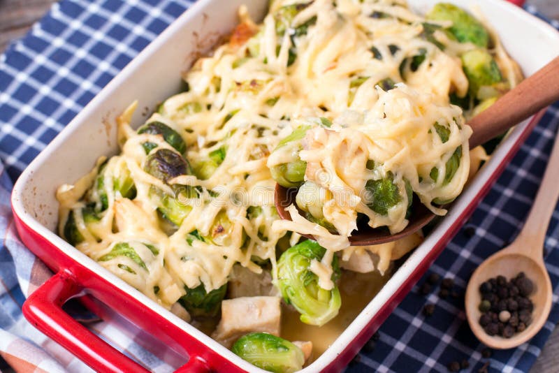 Brussels Sprouts Baked in Sauce with Cheese in a Ceramic Form Stock