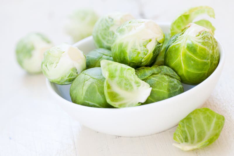 Brussels sprouts in a bowl stock photo. Image of dish 21635488