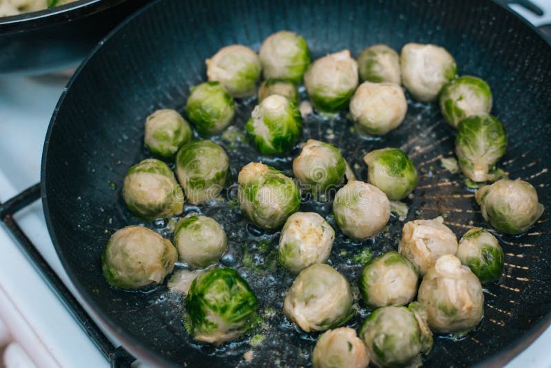Brussels Sprouts in the Pan. Fried Cabbage in Butter Stock Photo