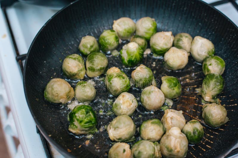 Brussels Sprouts in the Pan. Fried Cabbage in Butter Stock Image