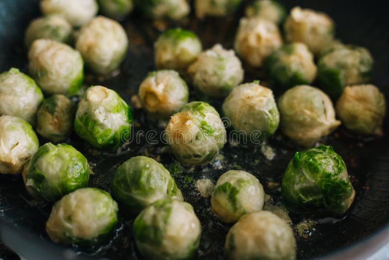 Brussels Sprouts in the Pan. Fried Cabbage in Butter Stock Image