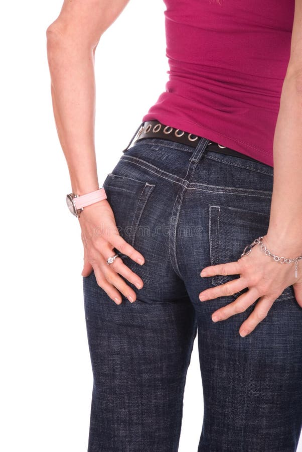 Close up shot of a womans shapely butt, she is wearing jeans and a bright pink top. White background. Close up shot of a womans shapely butt, she is wearing jeans and a bright pink top. White background.