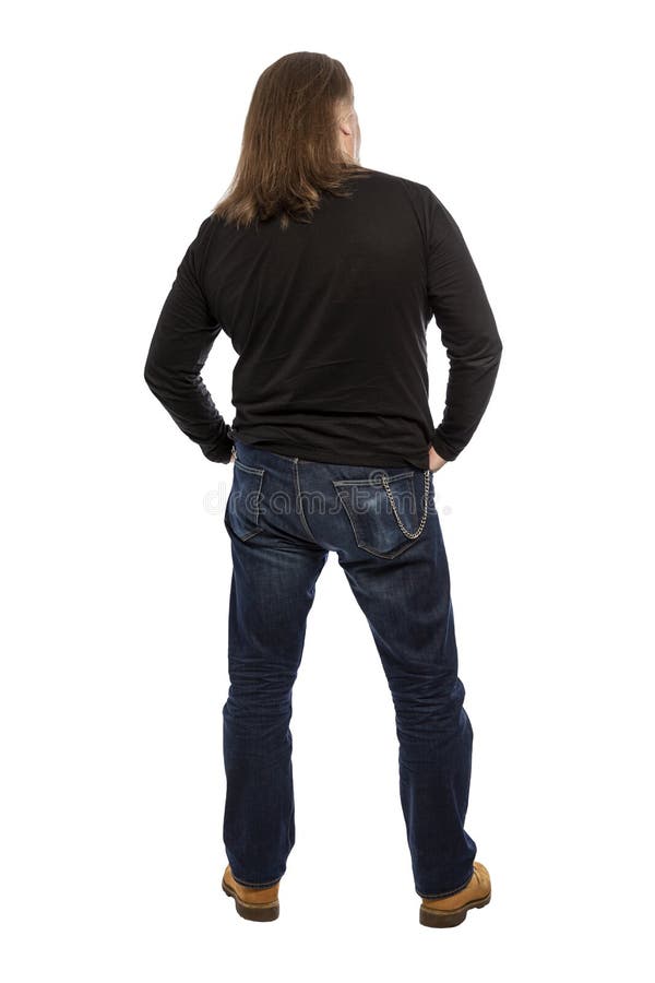 Brutal middle-aged adult man in full growth back. Vertical. Isolated on a white background royalty free stock photography Brutal middle-aged adult man in full growth back. Vertical. Isolated on a white background royalty free stock photography