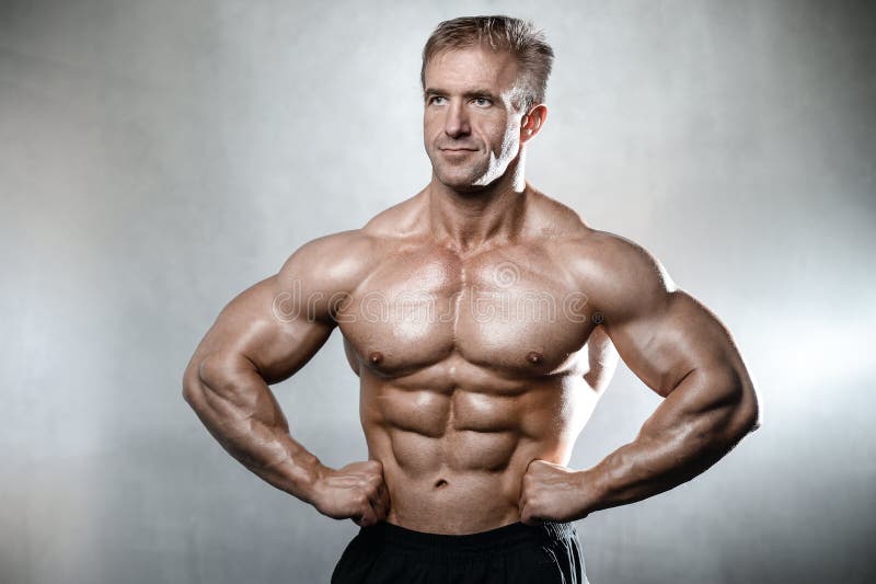 Brutal Strong Bodybuilder Old Man Posing In Studio Grey ... Brutal Strong Bodybuilder Old Man Posing In Studio Grey ...