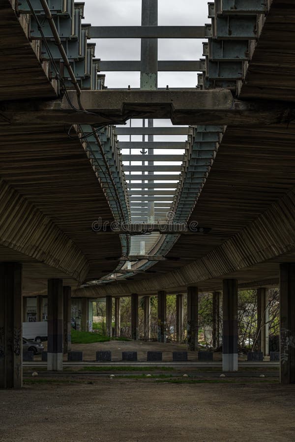 Brutalist architecture style example, low angle view of large concrete overpass bridge royalty free stock photography