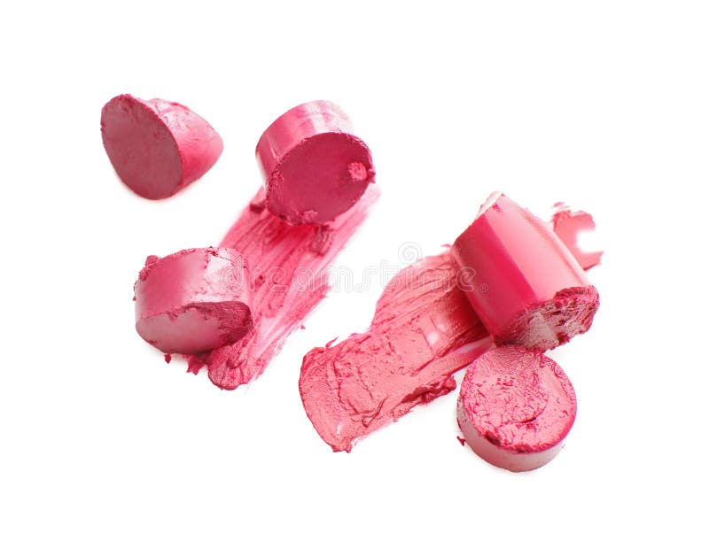 Brutna rosa läppstift med slaglängder på vit bakgrund arkivfoton Brutna rosa läppstift med slaglängder på vit bakgrund arkivfoton
