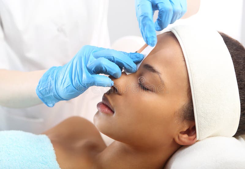 Hair removal, eyebrow regulation wax in the beauty salon. Hair removal, eyebrow regulation wax in the beauty salon