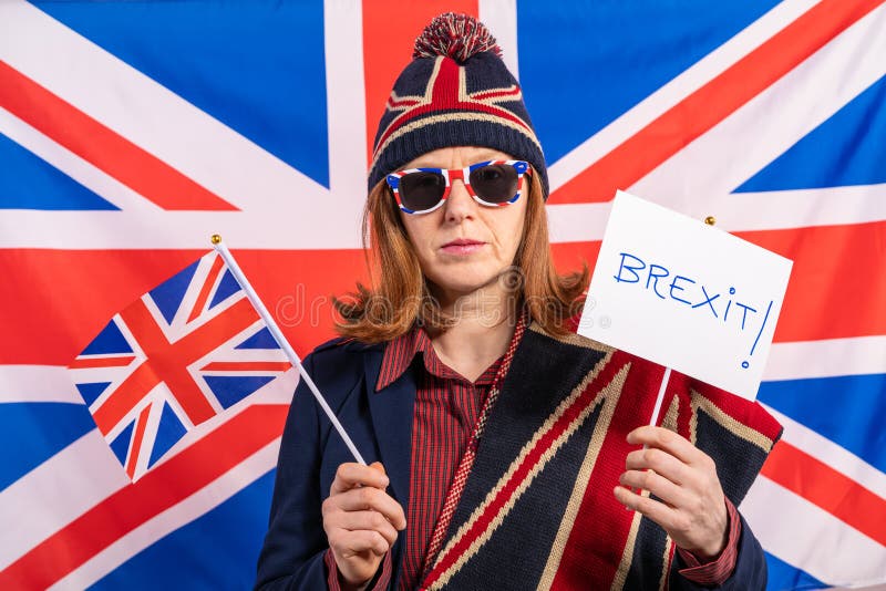 Brytyjskiej kobiety UK flaga i Brexit sztandar zdjęcia stock Brytyjskiej kobiety UK flaga i Brexit sztandar zdjęcia stock
