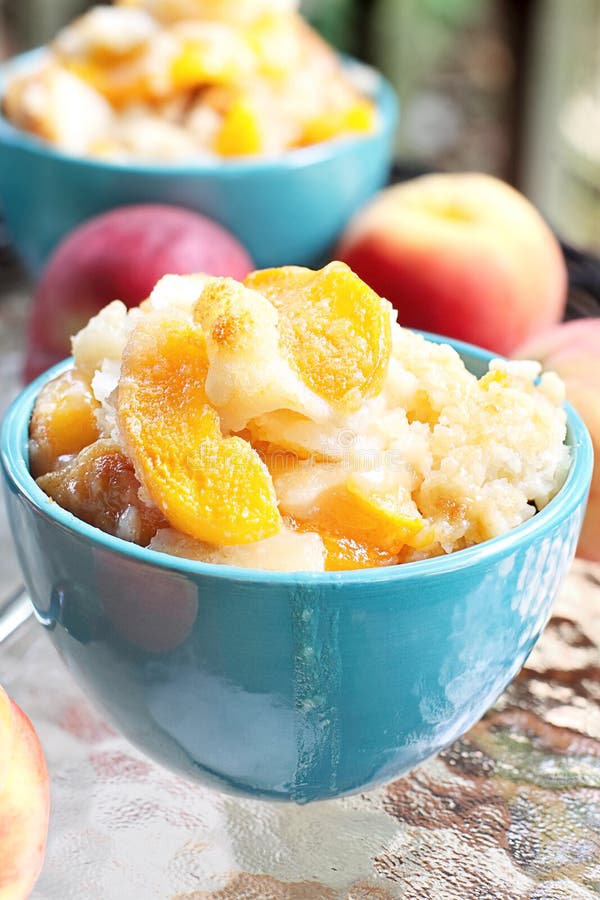 Fresh peach cobbler served outdoors. Fresh peach cobbler served outdoors.