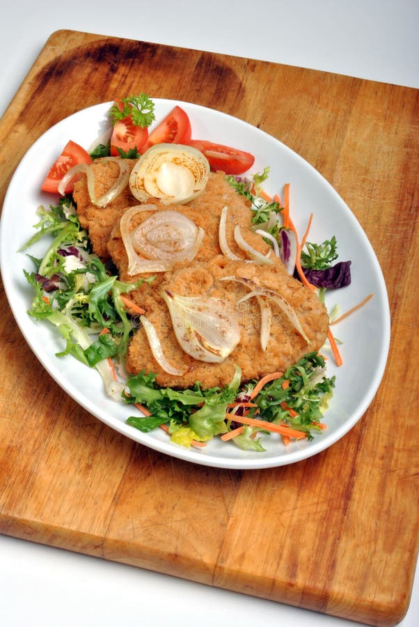 Bröad fiskörtsteak arkivfoto