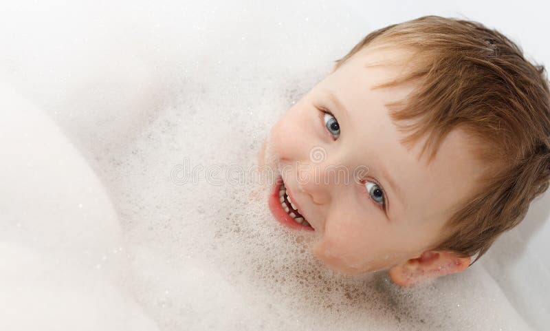 Bubble bath - boy washing royalty free stock photo