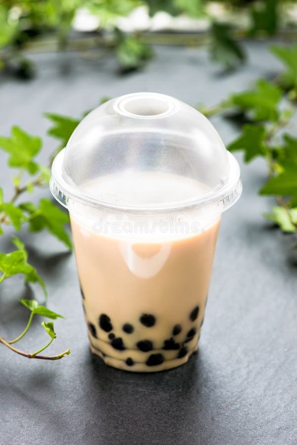 Bubble Boba Tea with Milk and Tapioca Pearls in Plastic Cup Stock Photo