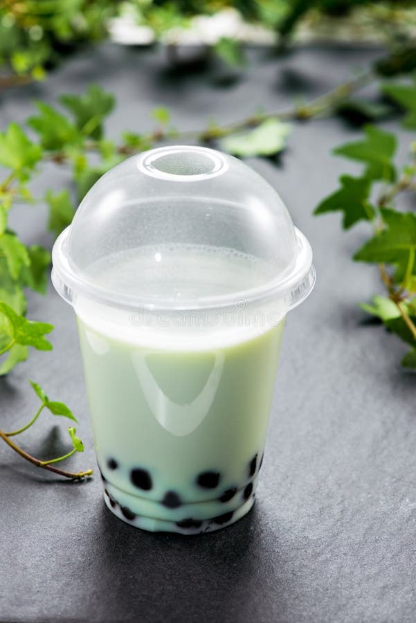 Bubble Boba Tea with Milk and Tapioca Pearls in Plastic Cup Stock Photo