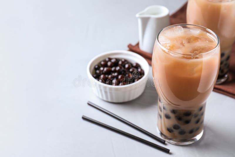 Bubble Milk Tea with Tapioca Balls on Light Table. Space for Text Stock