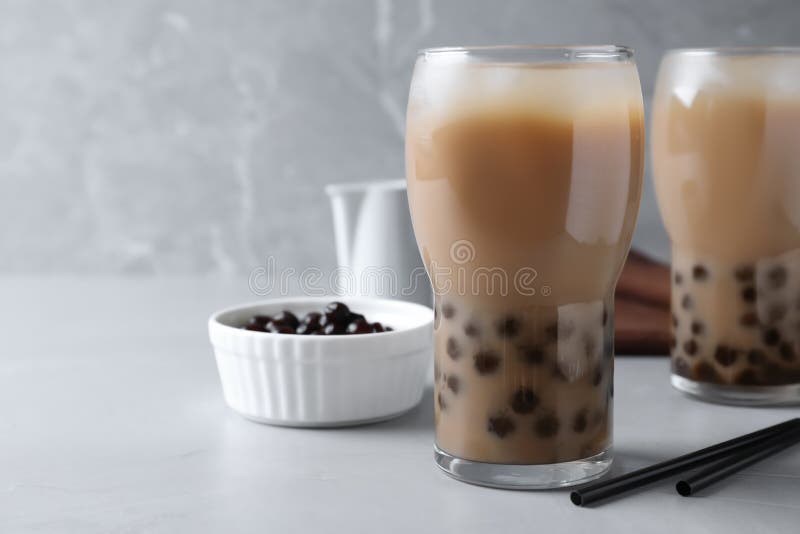 Bubble Milk Tea with Tapioca Balls on Light Table. Space for Text Stock