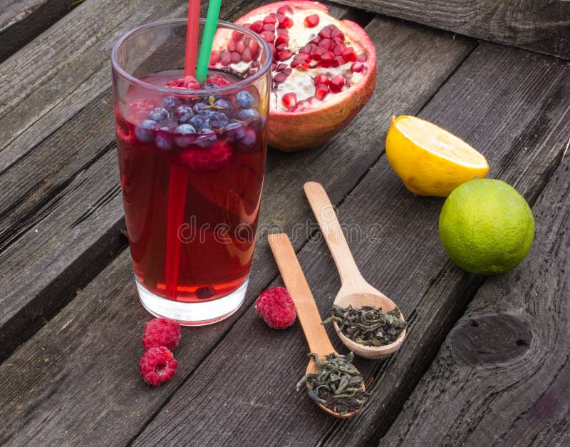 Bubble Tea with Pomegranate, Green Tea and Raspberry on a Wooden