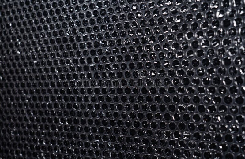 Plastic Packaging Material with Air Bubbles on Black Background Stock