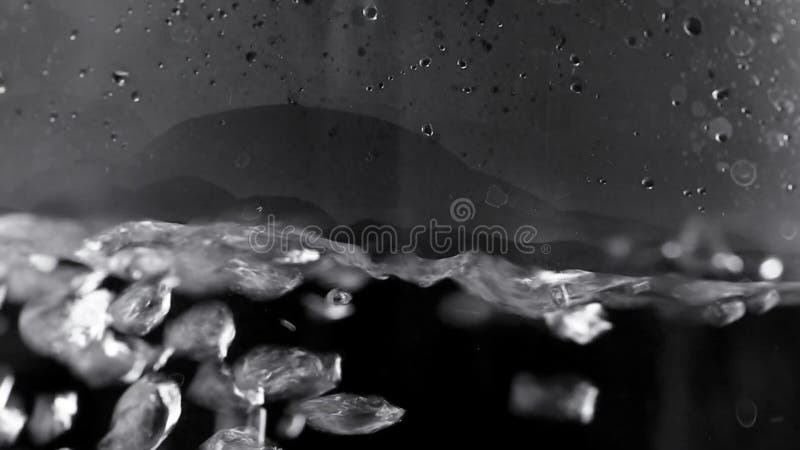 A bubbles rise upwards in boiling water stock video