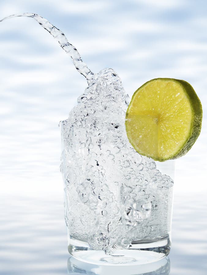 Bubbling water with lemon royalty free stock images