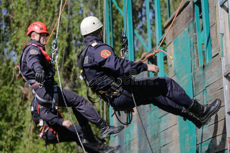 Firefighters are Rappelling and Climbing Ropes Editorial Photo Image