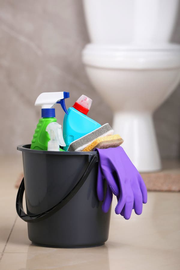 Bucket with Cleaning Supplies on Floor in Bathroom Stock Photo - Image ...