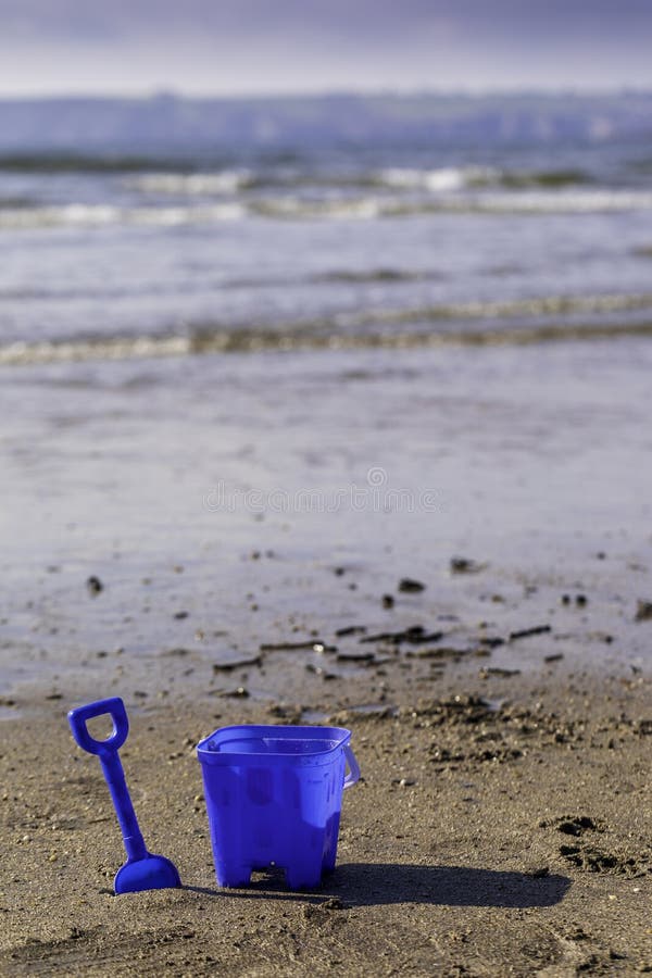 A Blue Bucket and Spade by the Shore Line Stock Image Image of