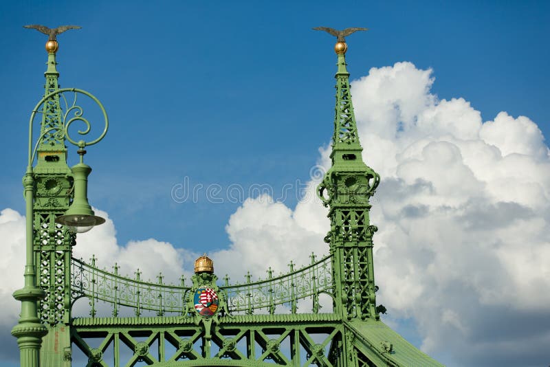 Budapest famous Freedom Bridge detail, green painted iron base, crown and shield with crest, and golden apple with bird