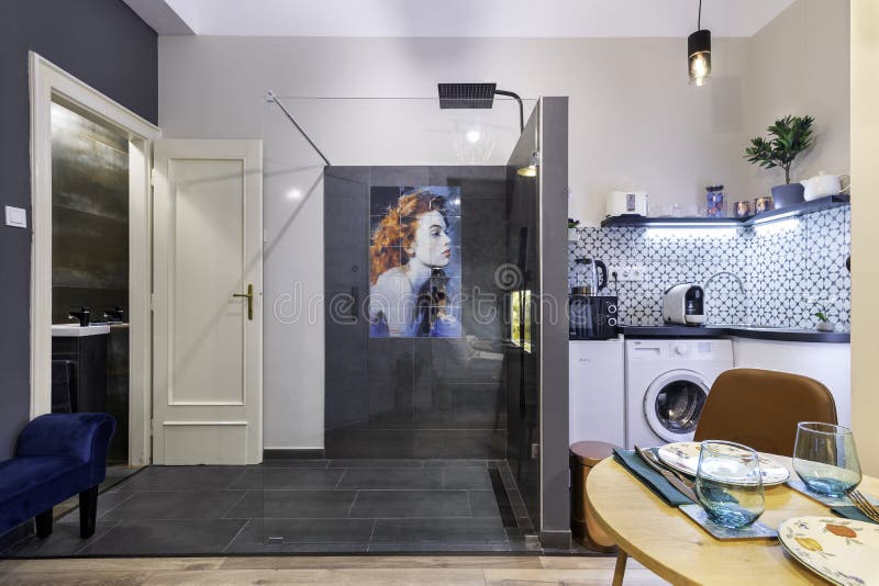 Budapest, Hungary - February 16, 2020: Luxurious tiny home space with a shower in the room. Budapest, Hungary - February 16, 2020: Luxurious tiny home space with a shower in the room