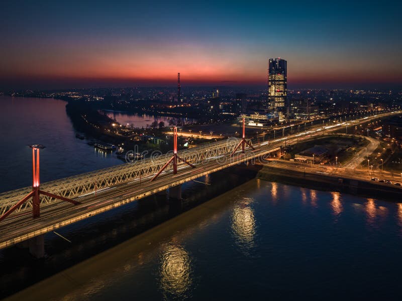 Budapest, Hungary - Aerial view of Rakoczi bridge above River Danube with traffic lights and MOL Campus skyscraper building