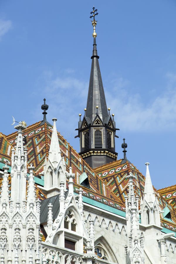 Budapest King Matthias Church Rooftop. The colorful rooftop and a black spire of historic 14th century King Matthias Church in Budapest old town Hungary