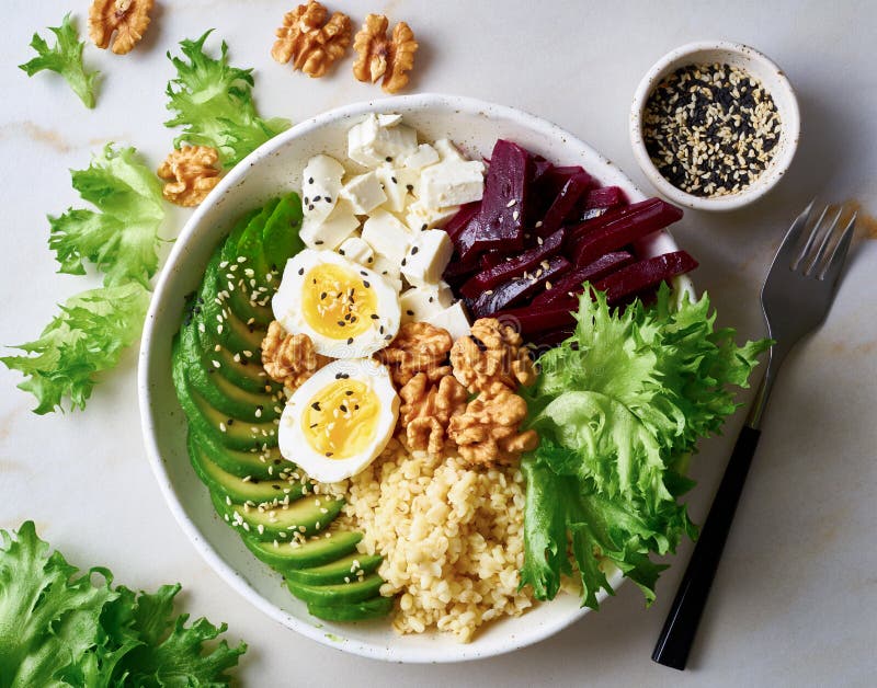 Buddha bowl, balanced food, vegetarian menu. Grey marble table, top view. Eggs, avocado, salad lettuce, bulgur, beetroot, tofu stock photo Buddha bowl, balanced food, vegetarian menu. Grey marble table, top view. Eggs, avocado, salad lettuce, bulgur, beetroot, tofu stock photo