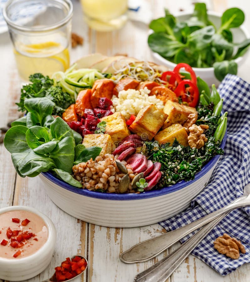 Buddha Bowl of Mixed Vegetables, Tofu Cheese and Groat on a Black ...