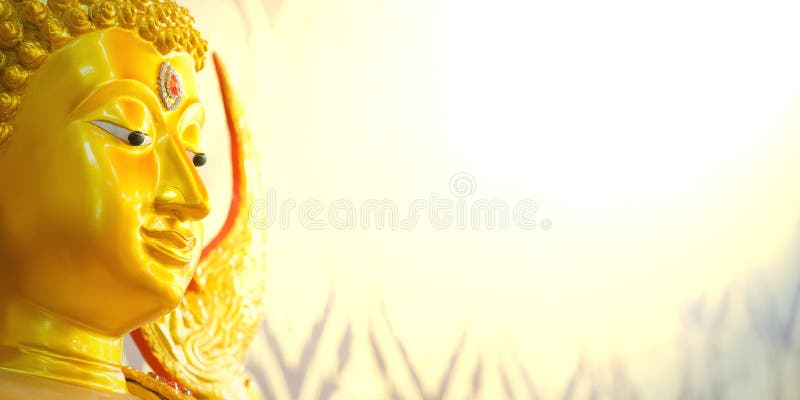 Buddha gold statue on golden background patterns stock photography