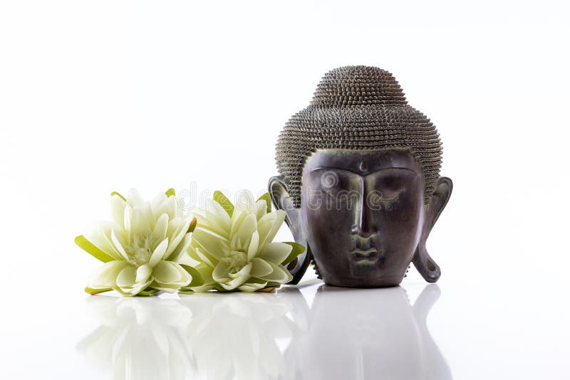 Buddha Head on a White Background, Towel, Stones and Lotus Stock Photo
