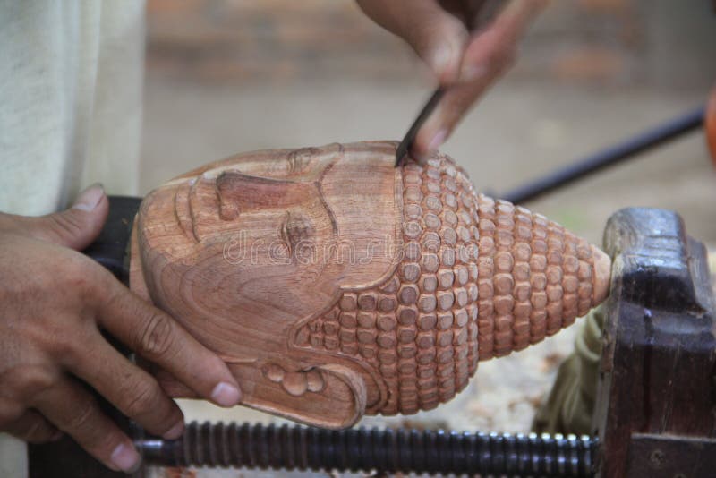 Buddha head wood crafting stock photo. Image of wood - 49634940