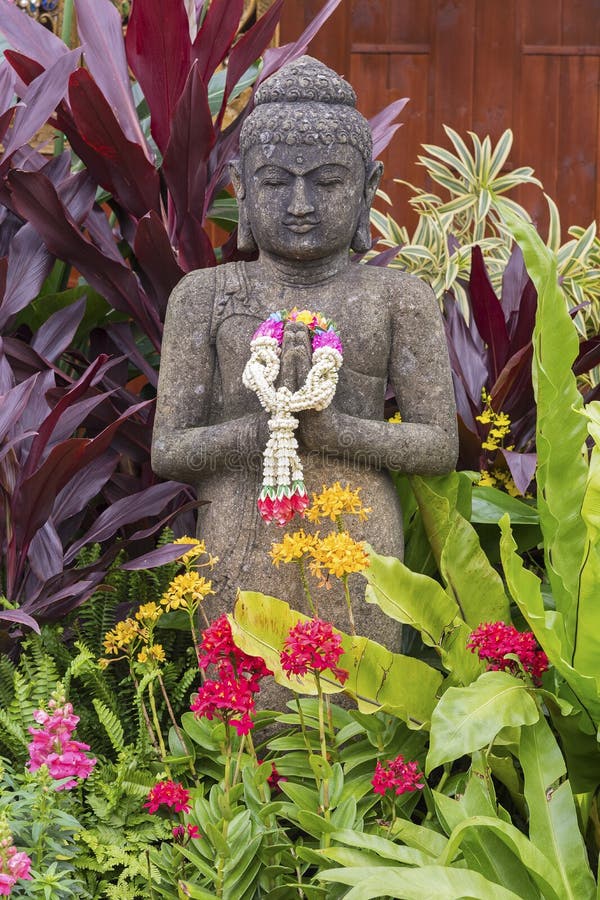 Buddha sculpture in garden stock photo. Image of exotic 84227704
