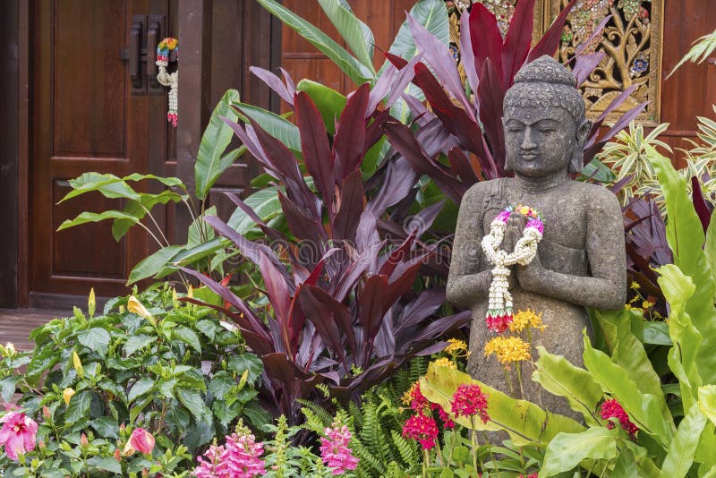Buddha sculpture in garden stock image. Image of evergreen 84229783