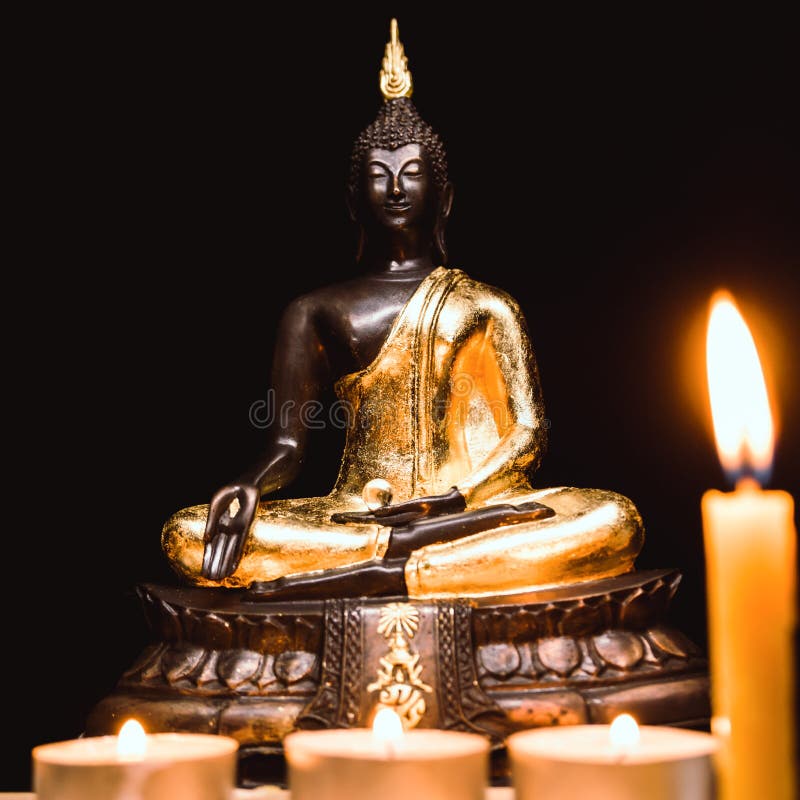 Buddha Statue and Light Candle with Light Dark Background . Stock Image ...