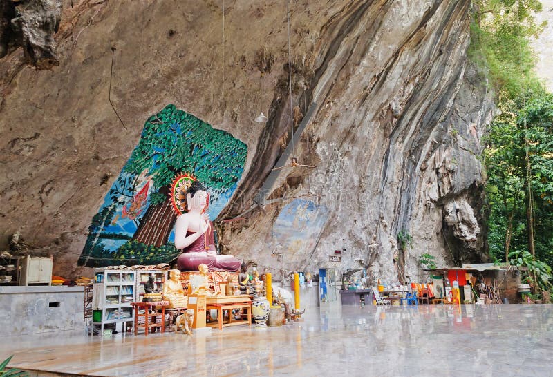 Buddha statue in a rock in the ancient forest