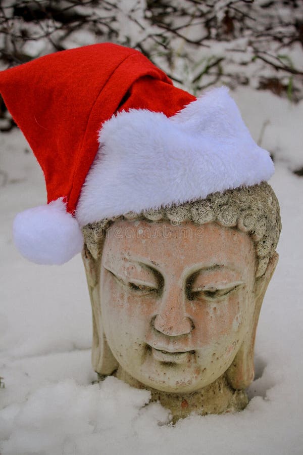 Buddha statue wearing Santa Hat