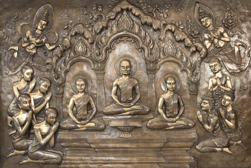 Buddha statues on temple wall in Thailand