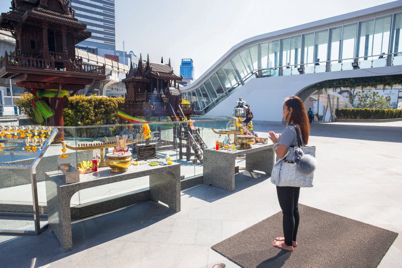 Buddhist faithful woman prays outside MBK Shopping Center, in Bangkok, Thailand. royalty free stock photography Buddhist faithful woman prays outside MBK Shopping Center, in Bangkok, Thailand. royalty free stock photography
