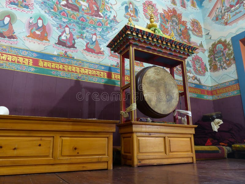 Traditional Drum and Murals Inside a Buddhist Monastery in Upper Pisang stock photography