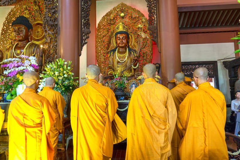 Ho Chi Minh City, Vietnam - May 29, 2018: Buddhist monk praying Buddha in Buddha`s birthday celebrations being held in temple morning as a ritual of traditional culture in Ho Chi Minh city, Vietnam