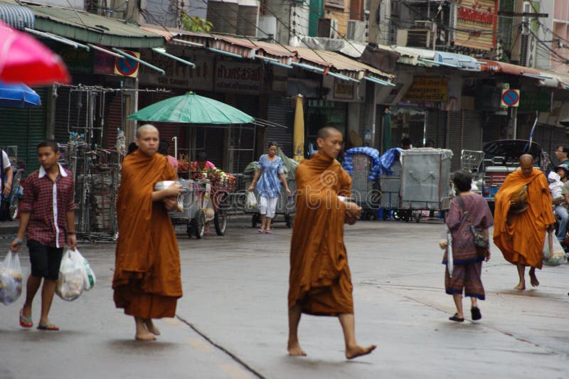 Buddhist monks alms on Bangkok`s streets stock photos Buddhist monks alms on Bangkok`s streets stock photos