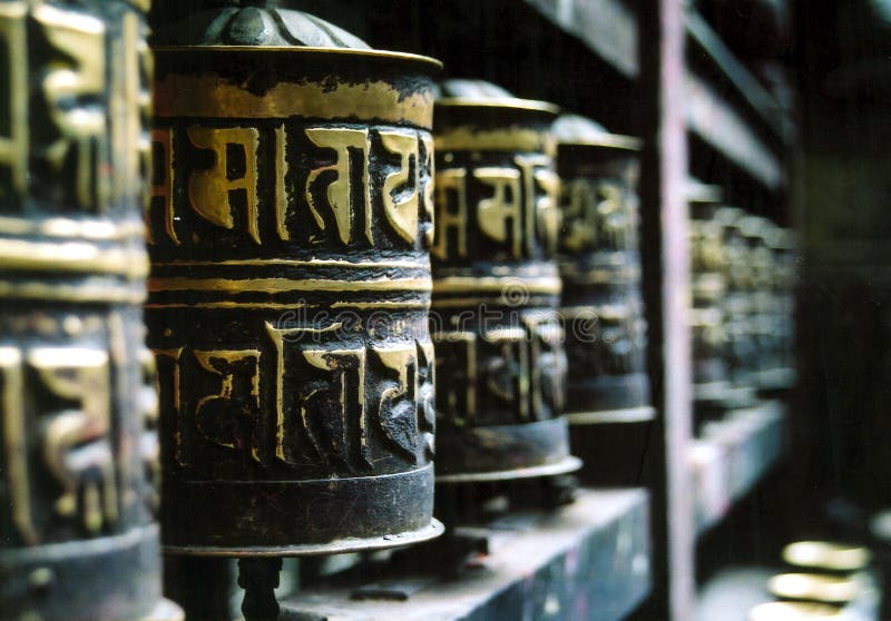 Buddhist Prayer Wheels in a Row stock image Buddhist Prayer Wheels in a Row stock image