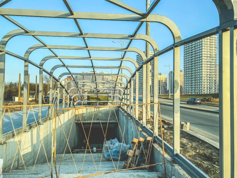 Construction of an underpass in the city center. the concrete structure is fenced off from the passage of tourists and residents. crossing. Construction of an underpass in the city center. the concrete structure is fenced off from the passage of tourists and residents. crossing