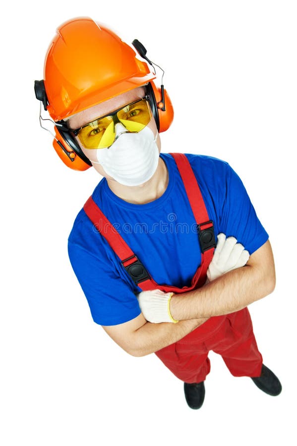 Portrait of young builder in protective safety equipment goggles hard hat earmuffs and respirator gas mask isolated. Portrait of young builder in protective safety equipment goggles hard hat earmuffs and respirator gas mask isolated