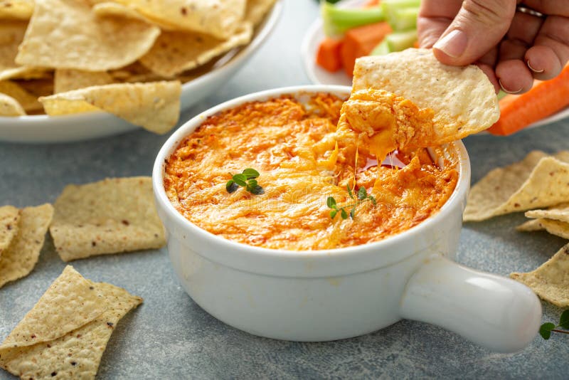 Buffalo chicken dip with chips. Buffalo chicken dip served with chips and fresh vegetables